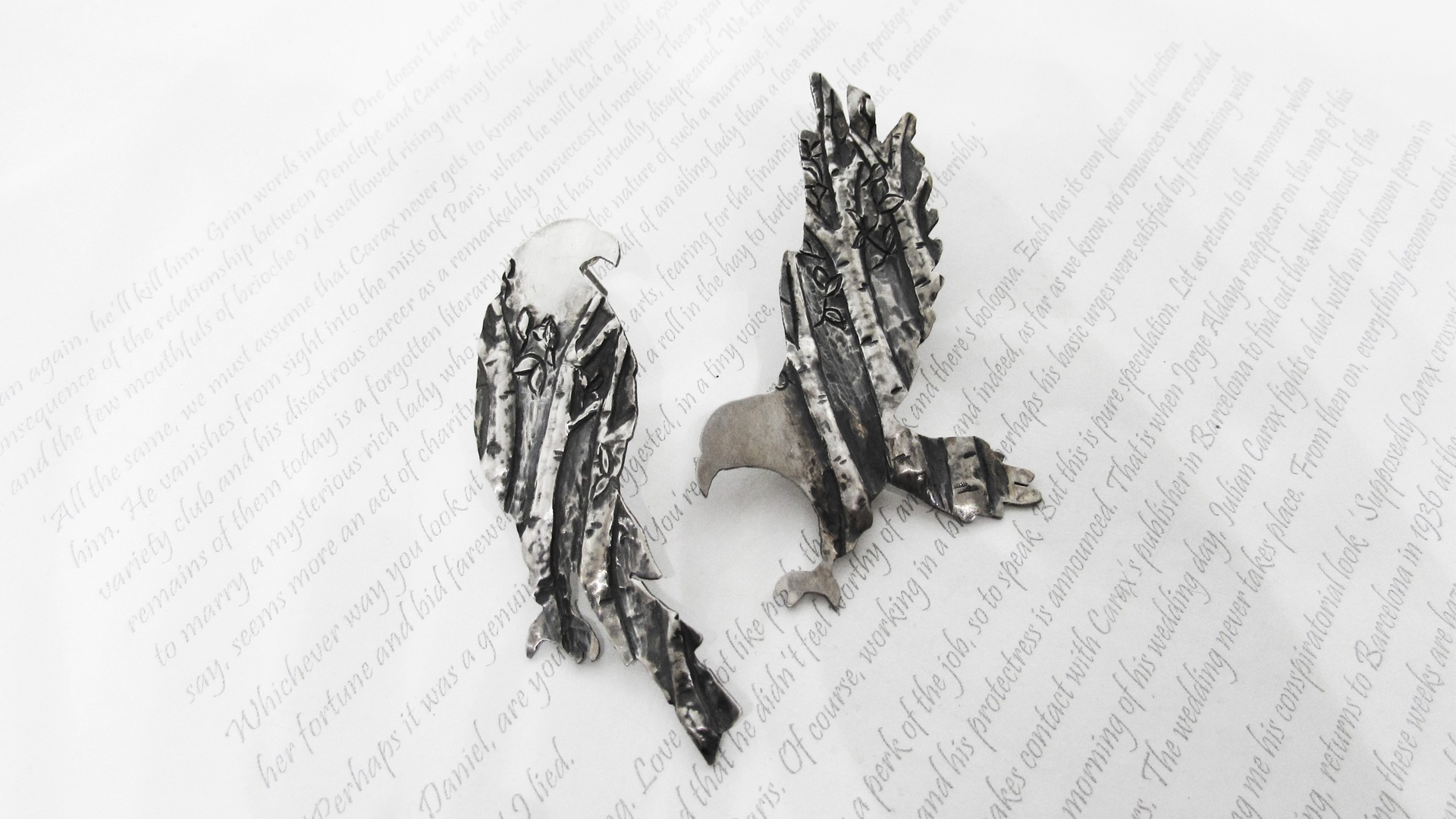 Eagles are made using sterling silver. The dimensional details are added by chasing and repoussé technique
