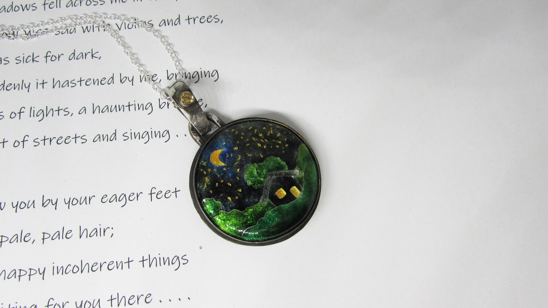 Starry night enamel pendant is made from silver, vitreous enamel and using a technique called cloisonné